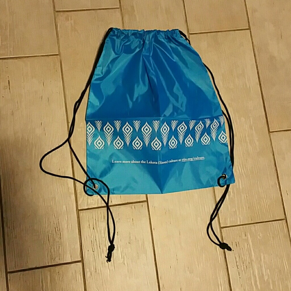 Blue Drawstring Backpack with white feather border